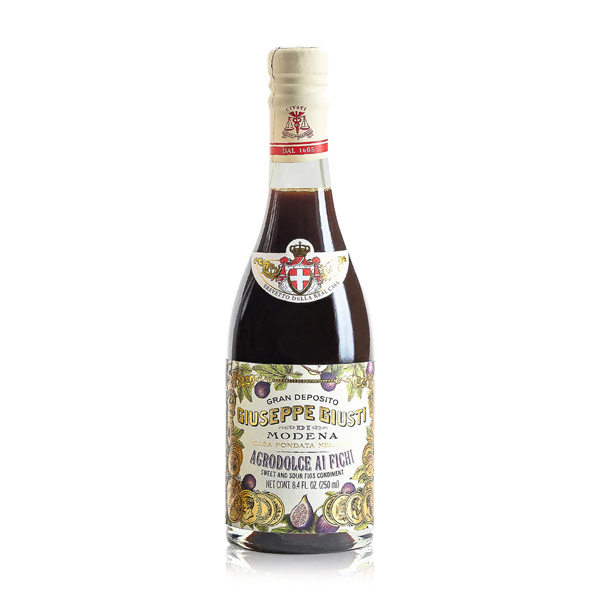 Flasche Giusti Agrodolce ai Fichi, vor hellem Hintergrund präsentiert – ein süß-saurer Balsamico mit intensivem Feigenaroma, ideal für Salate und Käseplatten.
